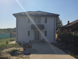 Maison sur structure métallique, finition des façades avec enduit décoratif extérieur thumbnail