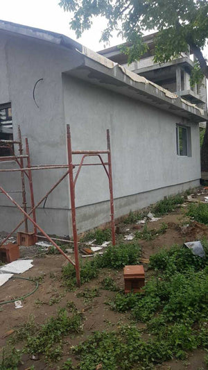 Application de mastic pour la façade du projet de maison en métal à Craiova thumbnail