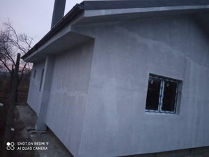 Application d'un revêtement d'apprêt et d'enduit décoratif structuré thumbnail
