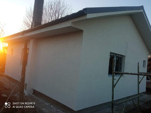 Application d'un revêtement d'apprêt et d'enduit décoratif structuré thumbnail
