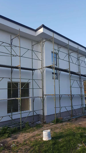 Construction d'une maison de 155 mètres carrés, application d'un enduit décoratif structuré thumbnail