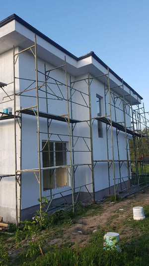 Construction d'une maison de 155 mètres carrés, application d'un enduit décoratif structuré thumbnail