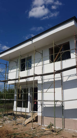 Construction d'une maison de 155 mètres carrés, application d'un enduit décoratif structuré thumbnail