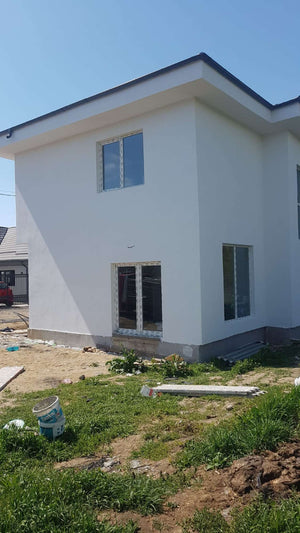 Construction d'une maison de 155 mètres carrés, application d'un enduit décoratif structuré thumbnail