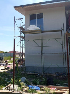 Construction d'une maison avec façades finalisées avec enduit décoratif extérieur thumbnail