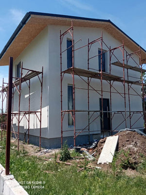 Construction d'une maison avec façades finalisées avec enduit décoratif extérieur thumbnail