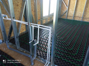 Construction d'une maison avec système de chauffage par le sol au rez-de-chaussée et à l'étage thumbnail