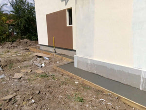Construction de trottoirs périphériques pour un projet de maison à Saftica thumbnail
