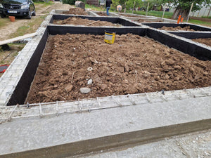 Démontage des poutres de fondation, application d'un revêtement bitumineux et remblai de terre thumbnail