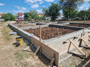 Démontage des poutres de fondation, application d'un revêtement bitumineux et remblai de terre thumbnail