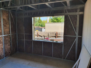 Isolation des murs extérieurs et des murs de séparation pour une maison sur structure métallique thumbnail