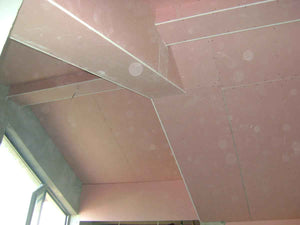 Aménagement des combles de 120 mètres carrés réalisé avec du plâtre ignifuge de couleur rouge thumbnail