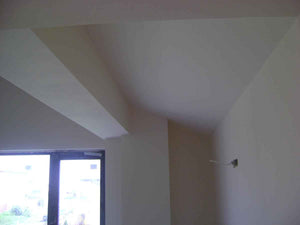 Aménagement des combles de 120 mètres carrés réalisé avec du plâtre ignifuge de couleur rouge thumbnail