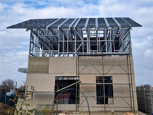 Revêtement extérieur en fibrociment pour une maison sur structure métallique thumbnail