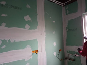 Revêtement intérieur en plaques de plâtre résistant au feu et à l'acoustique pour une halle métallique thumbnail