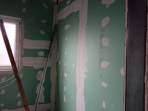 Revêtement intérieur en plaques de plâtre résistant au feu et à l'acoustique pour une halle métallique thumbnail