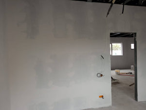 Revêtement intérieur en plaques de plâtre résistant au feu et à l'acoustique pour une halle métallique thumbnail