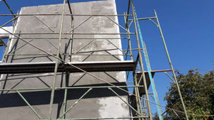 Projet de maison à un stade où l'enduit est appliqué sur les façades thumbnail