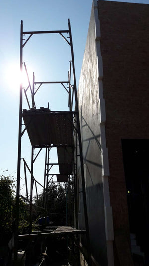 Projet de maison à un stade où l'enduit est appliqué sur les façades thumbnail