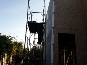 Projet de maison à un stade où l'enduit est appliqué sur les façades thumbnail