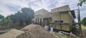 Isolation thermique extérieure à la laine de roche et enduit de finition pour la construction d'une maison de 130 mètres carrés thumbnail